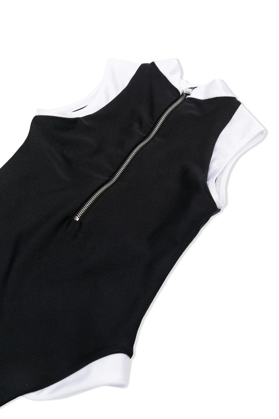 Black and white sleeveless top with zipper on a white background