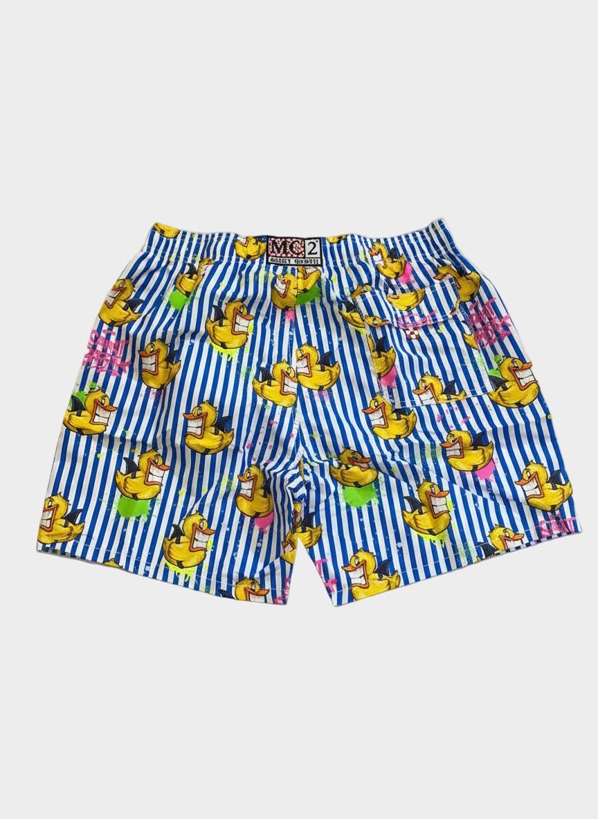 Striped shorts with cartoon duck design on a beige floor