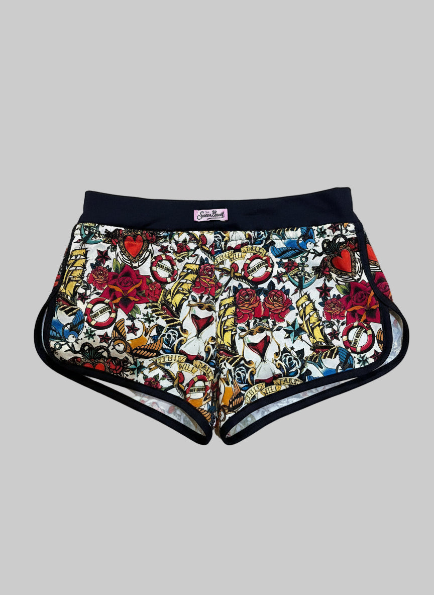 Shorts with a colorful tattoo-style pattern on a white background