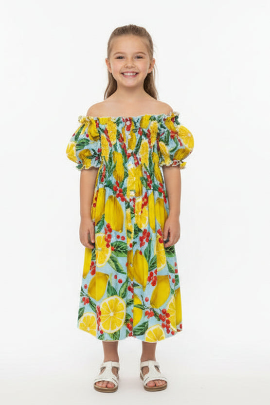 Colorful dress with lemon and berry pattern on a white background