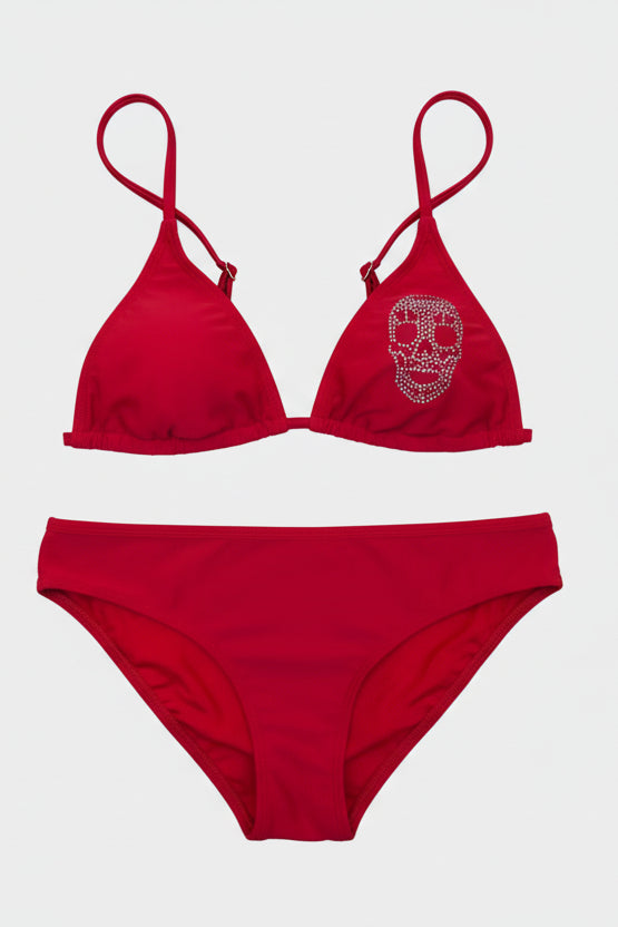 Red bikini set with skull design on a light background
