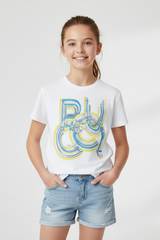 Young girl wearing a white t-shirt with colorful text design on a plain background