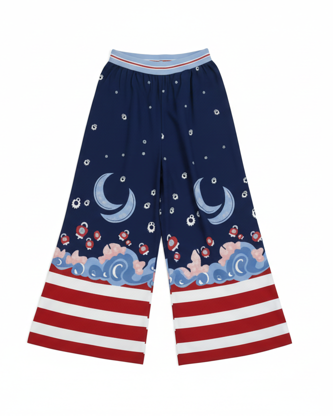 Navy blue pants with celestial pattern and red and white striped hem on a light gray background
